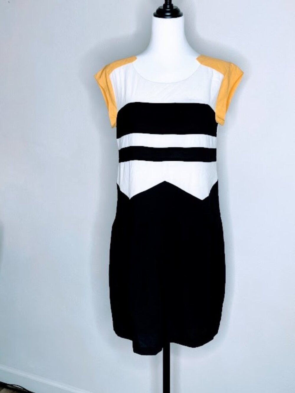 #75061 garment is a color-blocked jumpsuit featuring yellow, white, and black,